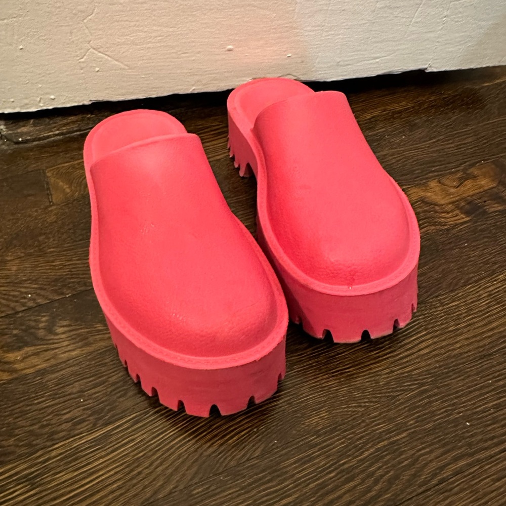Bright pink clogs